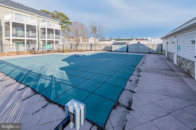 view of pool with a patio, fence, and a fenced in pool