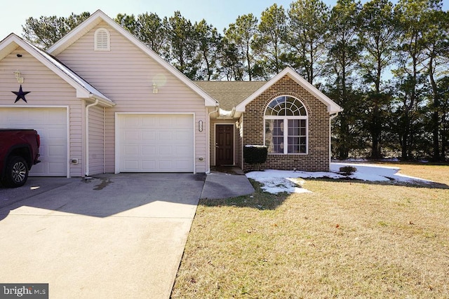 ranch-style home featuring a garage, driveway, a front lawn, and brick siding