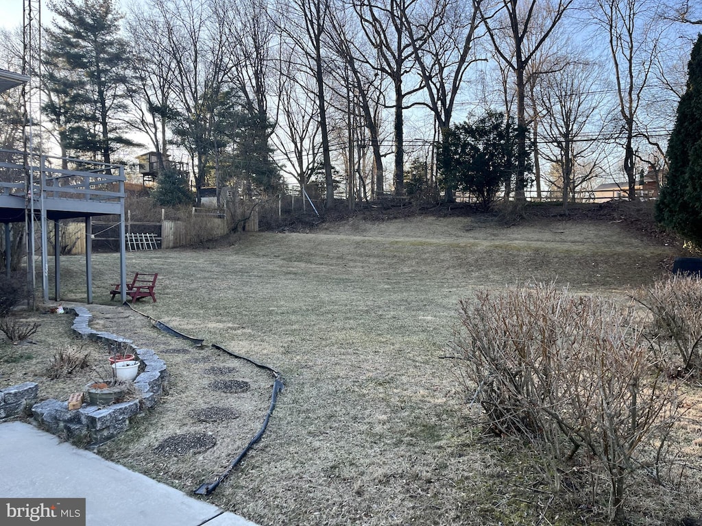 view of yard featuring a wooden deck