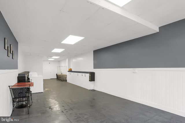 interior space with washer / clothes dryer and wainscoting