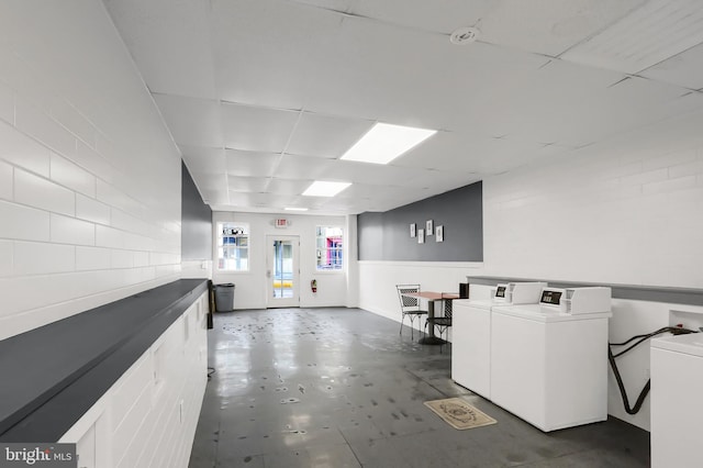 community laundry room featuring washing machine and dryer