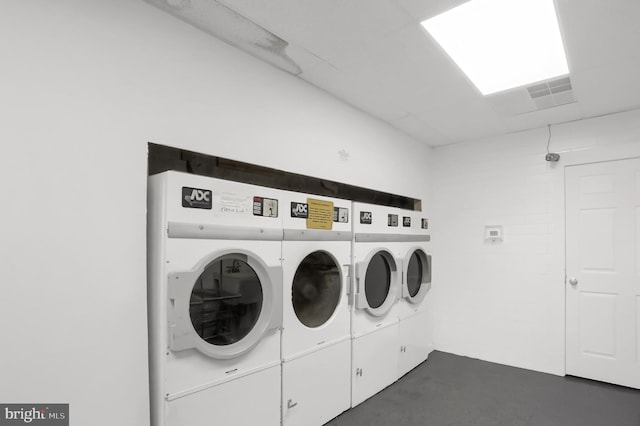 common laundry area with independent washer and dryer and visible vents