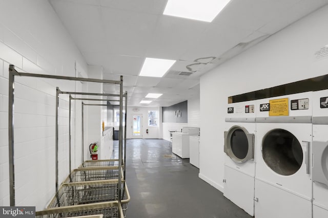 common laundry area featuring washing machine and dryer