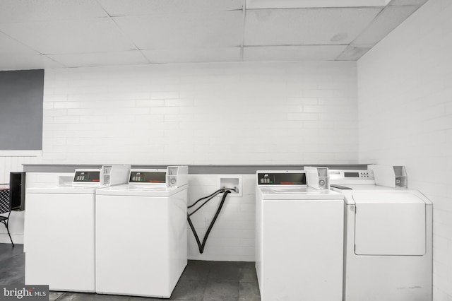 community laundry room with washing machine and clothes dryer