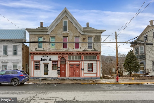 multi unit property featuring a chimney