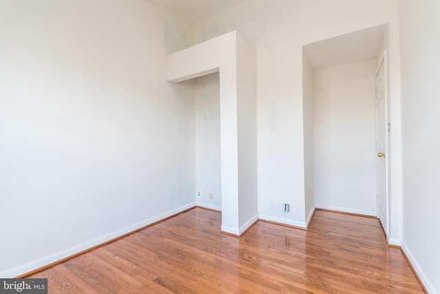 unfurnished bedroom with light wood-style floors and baseboards