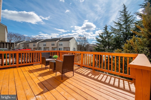 wooden terrace featuring a residential view