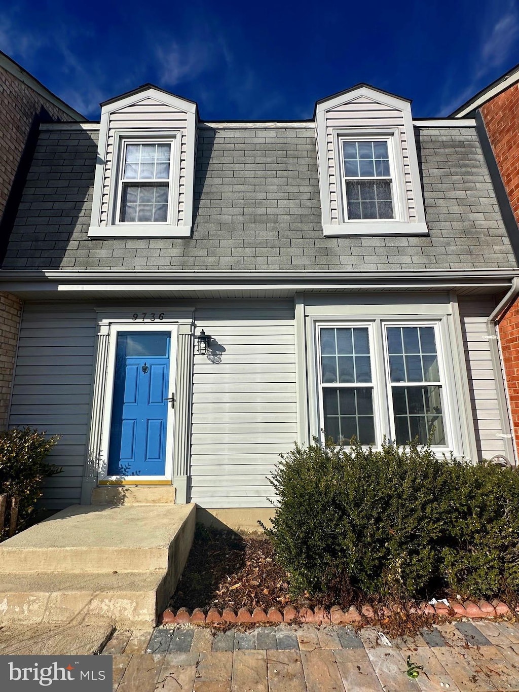 view of front of home featuring a shingled roof