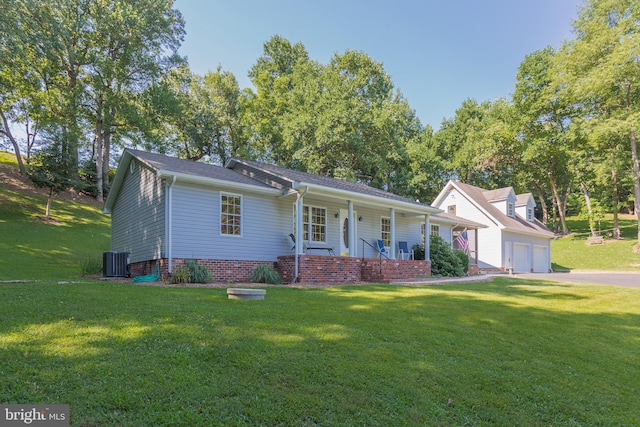 single story home with cooling unit, a porch, driveway, and a front yard