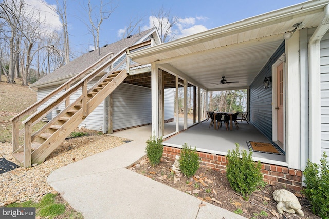 view of patio / terrace with stairway and a ceiling fan