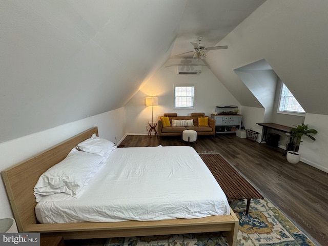 bedroom with a ceiling fan, vaulted ceiling, wood finished floors, and a wall mounted air conditioner