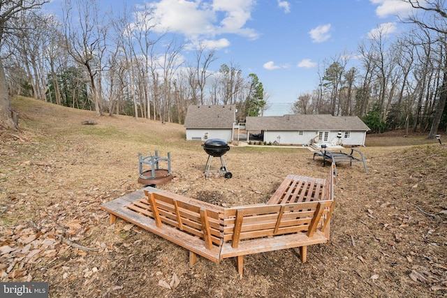 view of yard featuring a fire pit