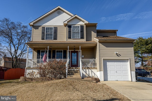 view of front of home featuring concrete driveway, a porch, and fence