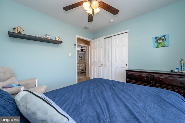 bedroom with a ceiling fan, a closet, and visible vents