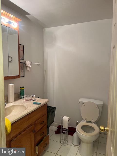 bathroom featuring vanity, toilet, and tile patterned floors