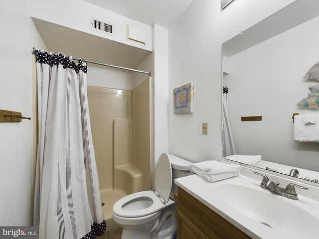 bathroom with toilet, a stall shower, visible vents, and vanity