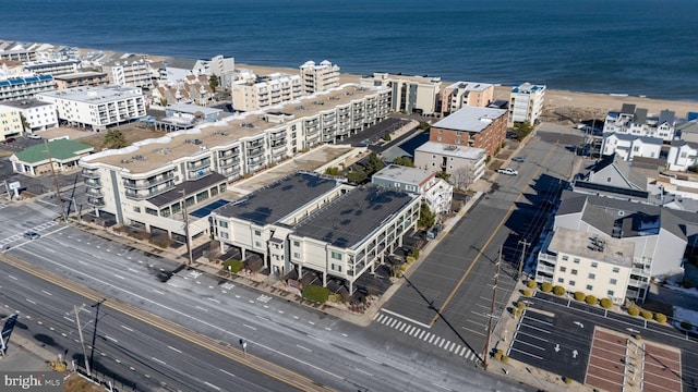 drone / aerial view featuring a water view and a view of city