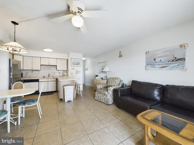 living room featuring ceiling fan and light tile patterned flooring