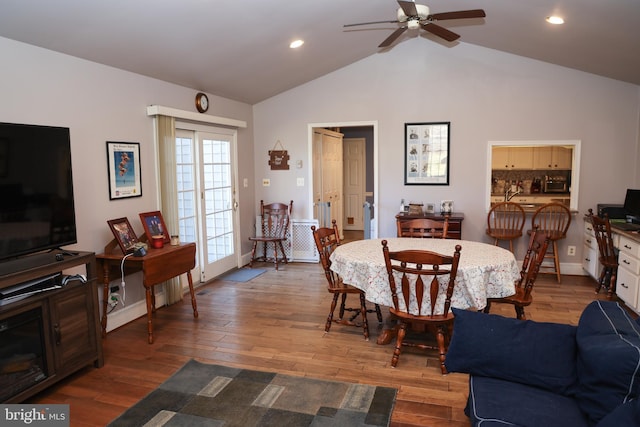 dining space featuring recessed lighting, wood finished floors, a ceiling fan, and vaulted ceiling