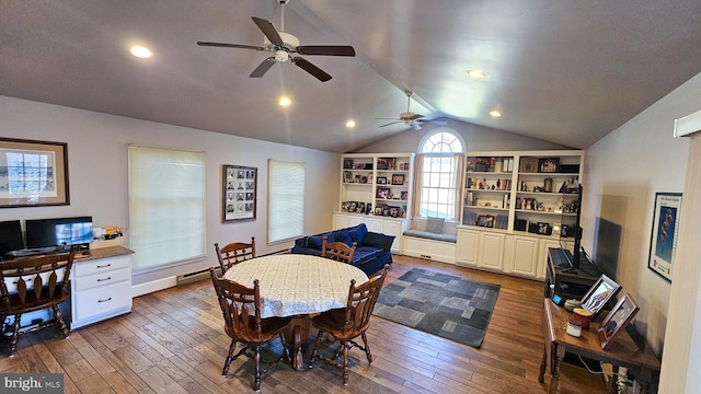 dining area featuring hardwood / wood-style floors, lofted ceiling, and ceiling fan