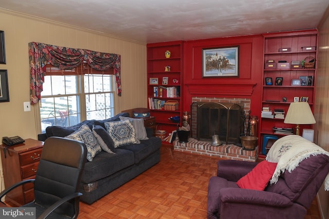 living room featuring built in features and a fireplace