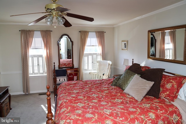 carpeted bedroom with multiple windows, baseboards, and ornamental molding