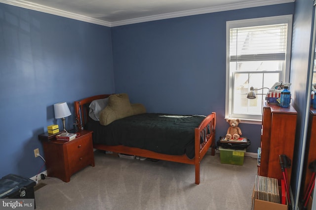 bedroom featuring crown molding, carpet, and baseboards