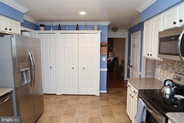 kitchen featuring stainless steel appliances, backsplash, white cabinets, and crown molding