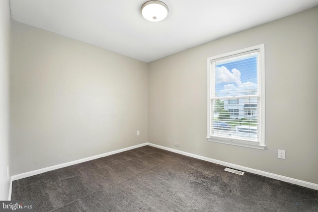 6254 Goulding Ct, Bealeton, VA 22712 - empty room featuring dark carpet and baseboards