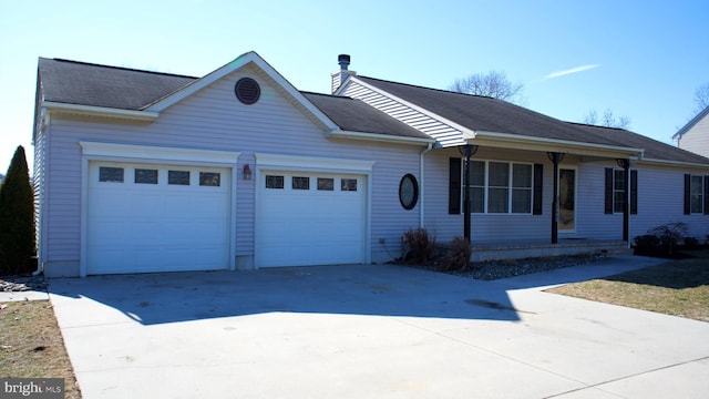 ranch-style house with driveway and an attached garage