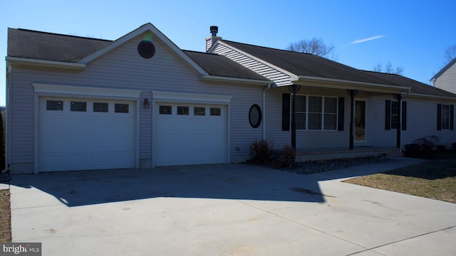 ranch-style house with an attached garage and concrete driveway