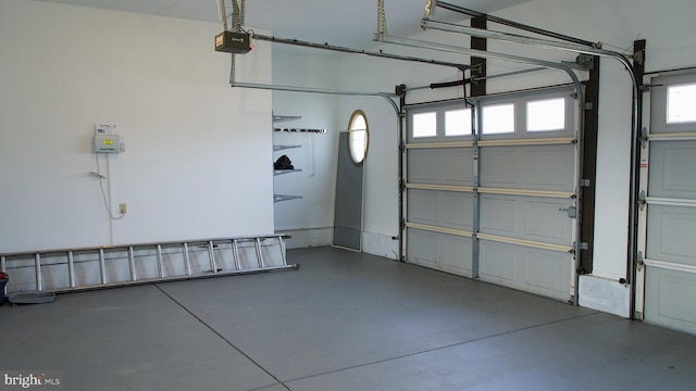 garage featuring a garage door opener