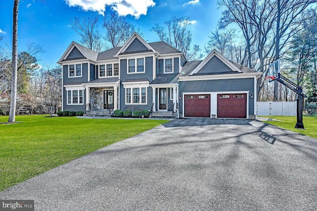 view of front facade with aphalt driveway, roof with shingles, an attached garage, fence, and a front lawn