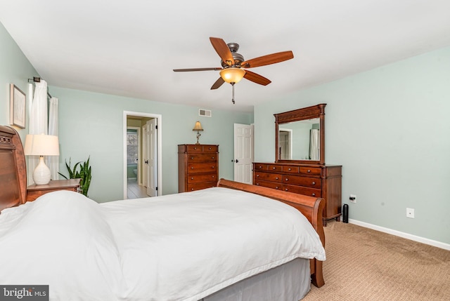 bedroom with light carpet, baseboards, visible vents, and a ceiling fan