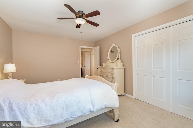 bedroom with a closet, light carpet, and ceiling fan