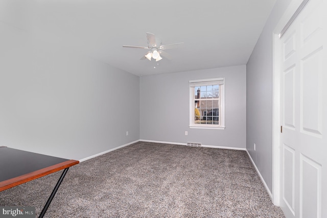 interior space featuring carpet, visible vents, ceiling fan, and baseboards