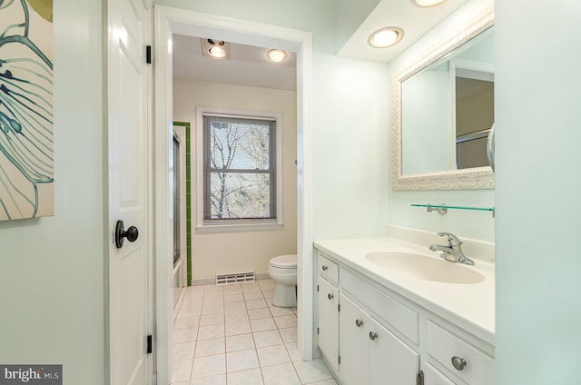 bathroom with toilet, tile patterned flooring, visible vents, and vanity