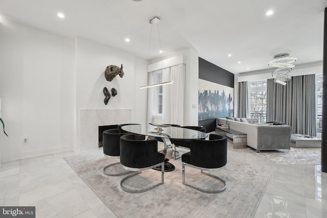 interior space with recessed lighting, a premium fireplace, and baseboards