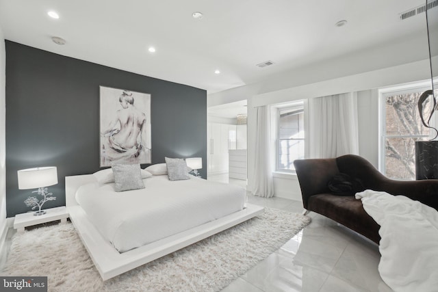 bedroom with recessed lighting, visible vents, marble finish floor, and baseboards