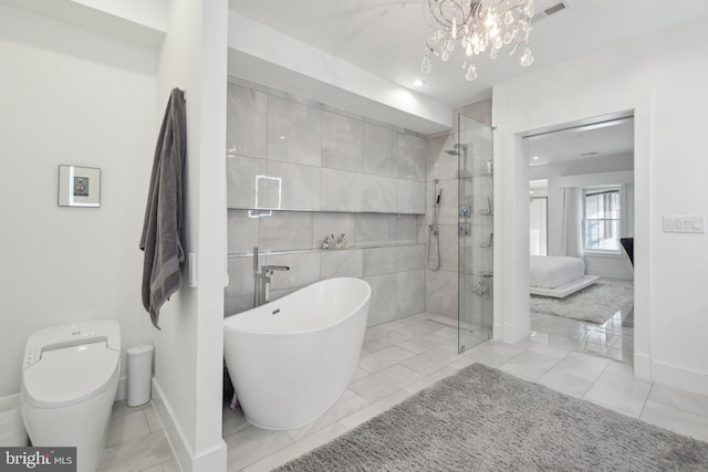 ensuite bathroom featuring visible vents, a freestanding bath, a shower stall, ensuite bathroom, and toilet