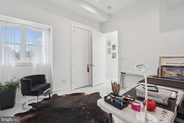 office space with light tile patterned floors and baseboards