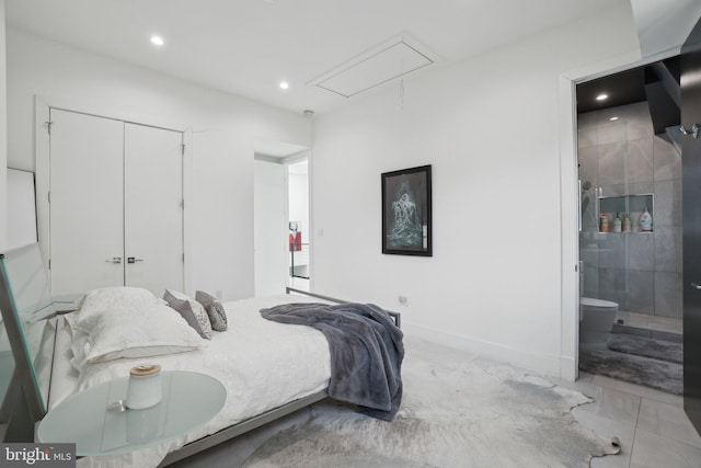 bedroom with ensuite bath, recessed lighting, a closet, baseboards, and attic access