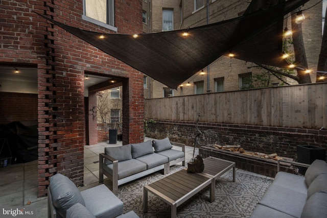 view of patio featuring an outdoor living space and fence private yard