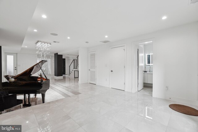 interior space featuring stairs, recessed lighting, visible vents, and baseboards