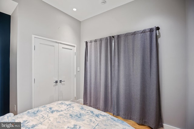 bedroom with a closet and recessed lighting