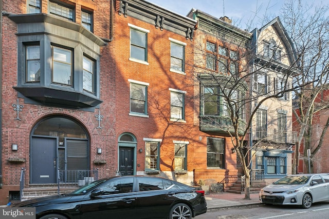 view of front of home featuring brick siding