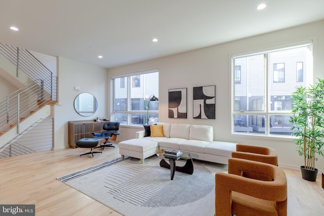 living room with stairs, baseboards, wood finished floors, and recessed lighting