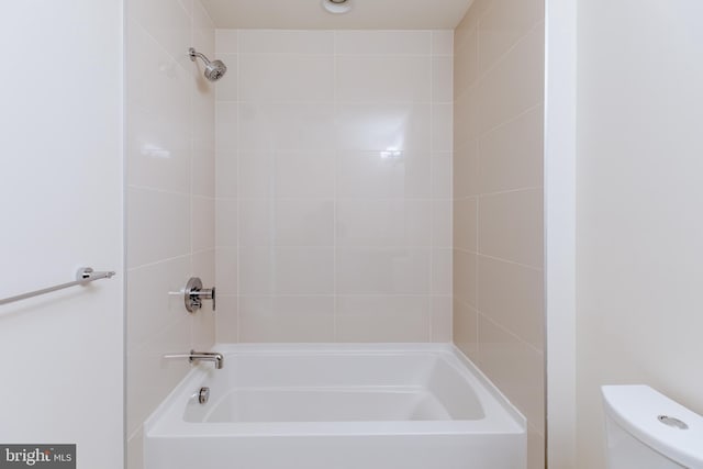 bathroom with shower / tub combination and toilet