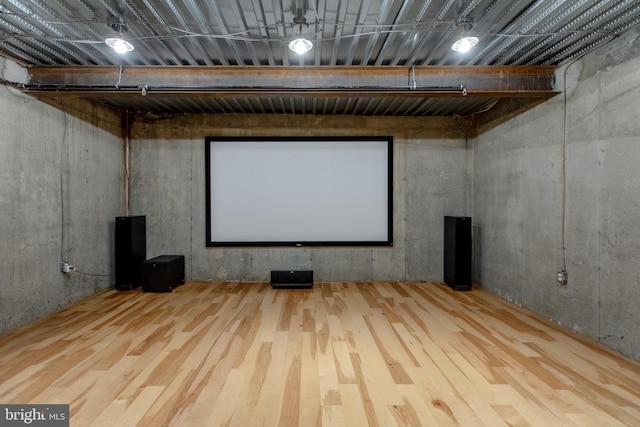 home theater room with wood finished floors