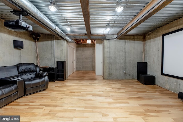 cinema room featuring light wood-style floors